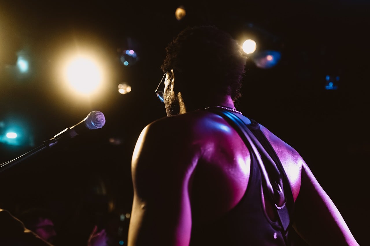 Concert, spotlight, musician — Online Poker for Beginners: FAQs About Playing Online Pokersafely.